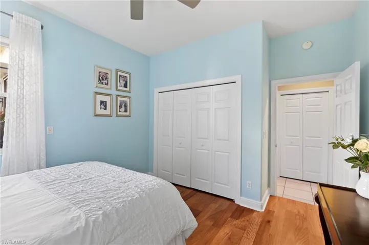 Bedroom with hardwood / wood-style flooring and ceiling fan