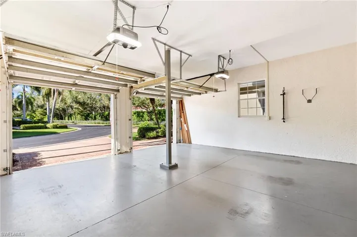 Garage featuring a garage door opener