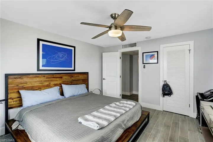 Bedroom with hardwood / wood-style flooring and ceiling fan