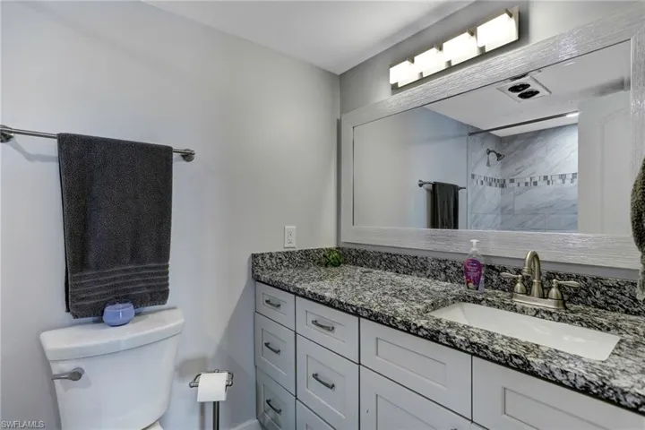 Bathroom with vanity and toilet