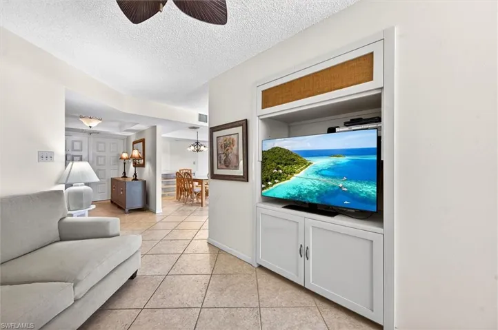 Built-in media center with upper storage and lower cabinetry