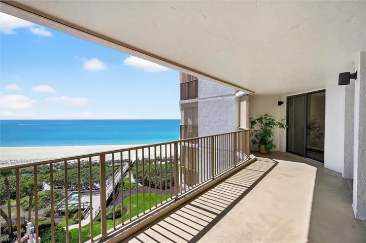 Expansive balcony with direct ocean frontage and beach access