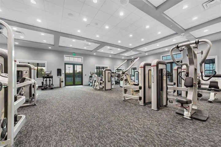 Workout area featuring french doors and a paneled ceiling