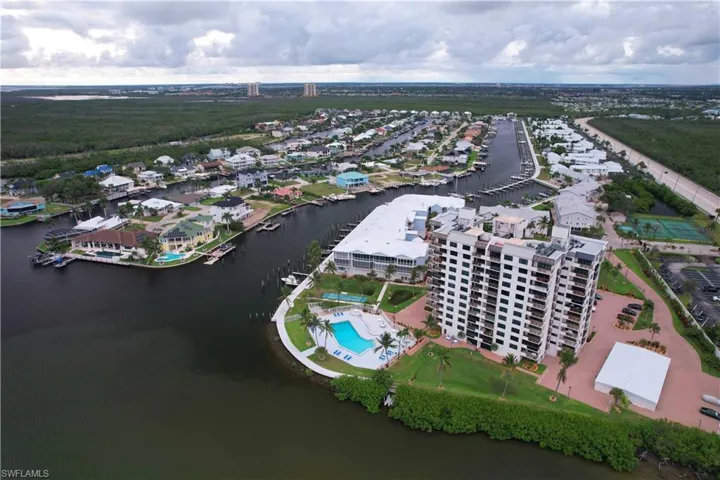 Drone / aerial view of a large body of water and a pool