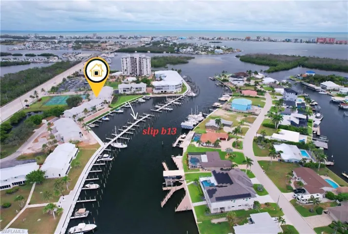 View of property location with a large body of water and a marina