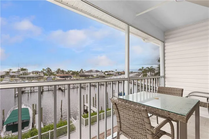 Balcony with a water view and a residential view