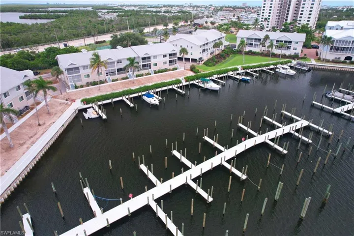 Drone / aerial view of a large body of water and numerous boat docks