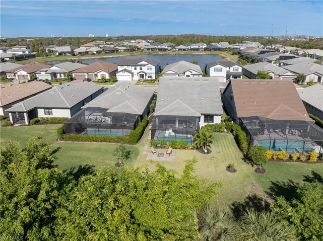Aerial perspective of suburban area with a pool area