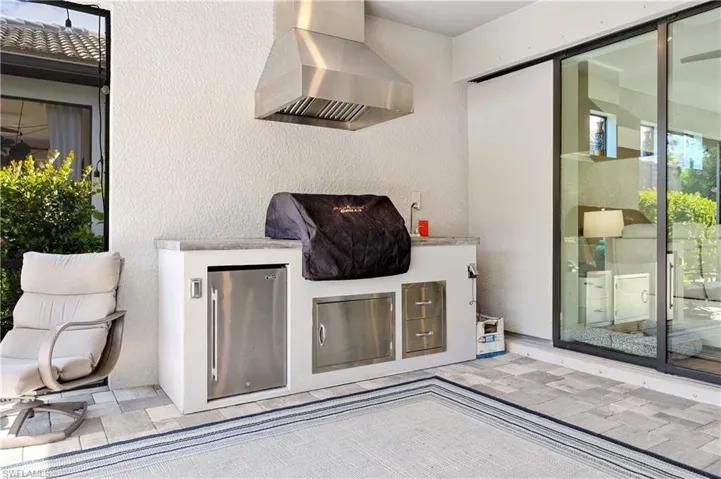 View of patio featuring exterior kitchen