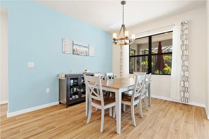 Dining area featuring a chandelier and wood finish floors