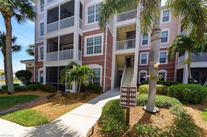 Entry to building leads to elevator inside. Well maintained building and landscaping.