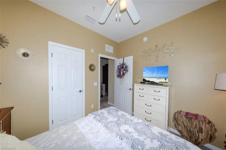 Spacious Guest bedroom with Plantation shutters.