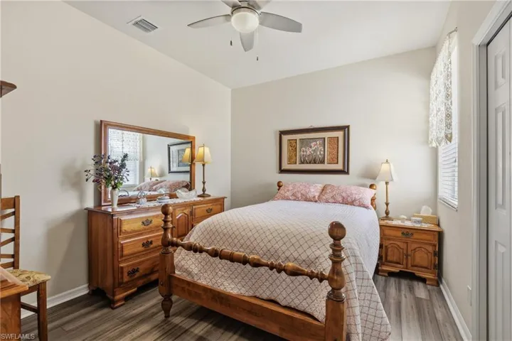 Bedroom featuring dark wood finished floors and ceiling fan