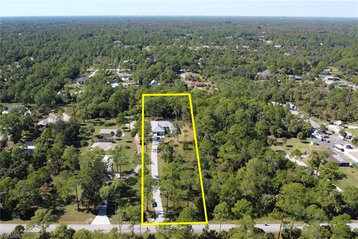 View of property location featuring property parcel outlined and a heavily wooded area