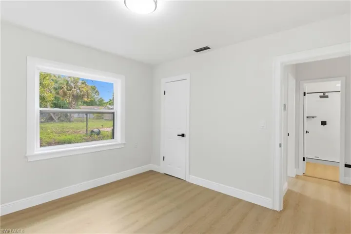 Inviting guest bedroom with natural light.