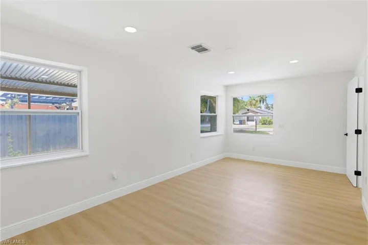 Comfortable primary bedroom with an open layout, creating a calm and restful space to unwind.