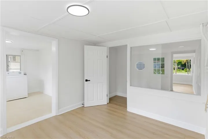 Comfortable den area providing seamless access to the laundry room, ideal for added functionality and organization.