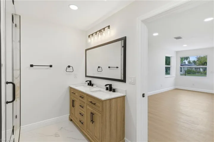 Stylish bathroom featuring a double vanity, designed for convenience and an elevated daily routine.