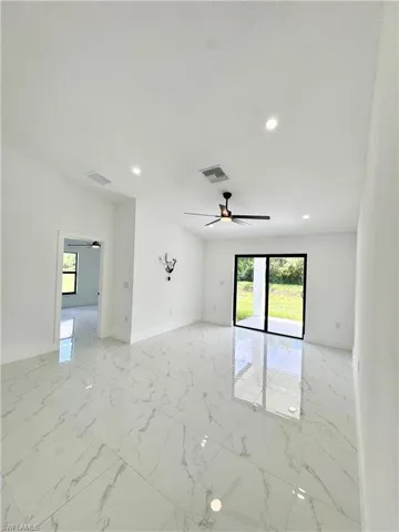 Empty room with baseboards and light marble finish floors
