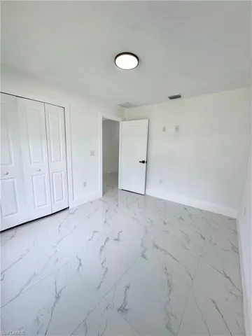 Living room with recessed lighting, a ceiling fan, and light tile patterned flooring