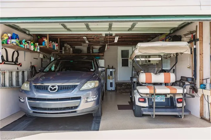 Garage featuring electric water heater