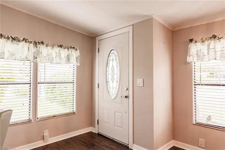 Foyer with dark wood-type flooring