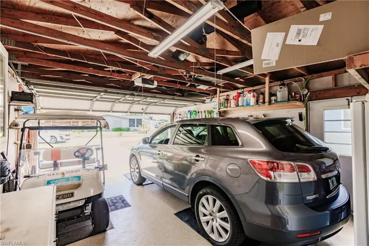 Garage featuring a garage door opener