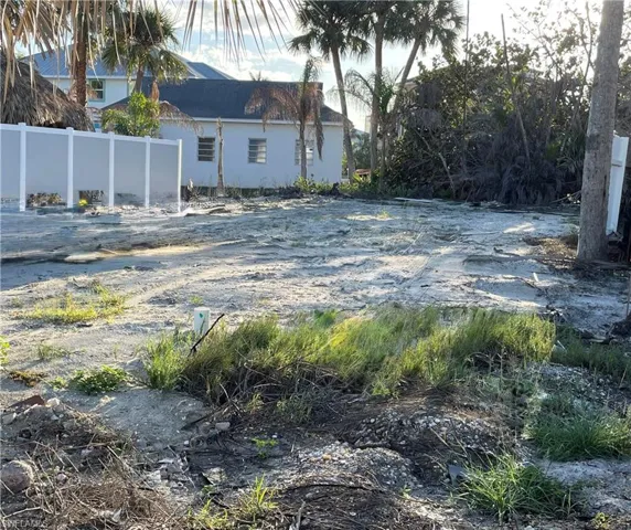 View of yard featuring fence