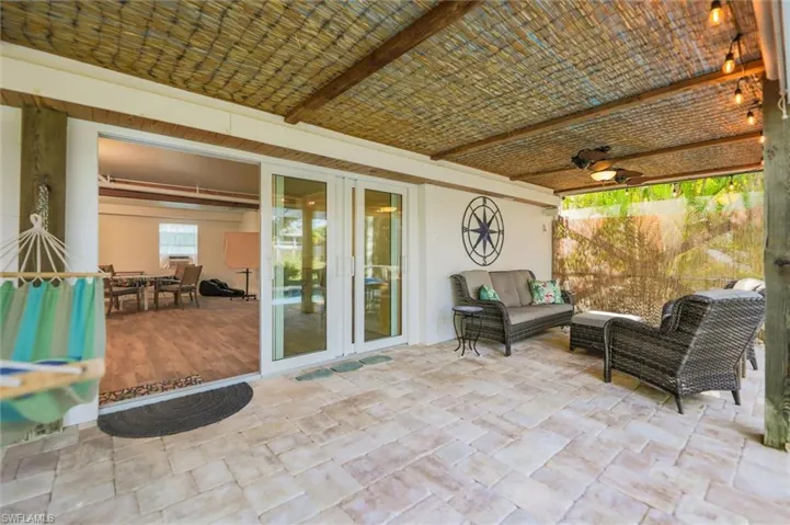 View of patio featuring french doors, outdoor lounge area, and a ceiling fan