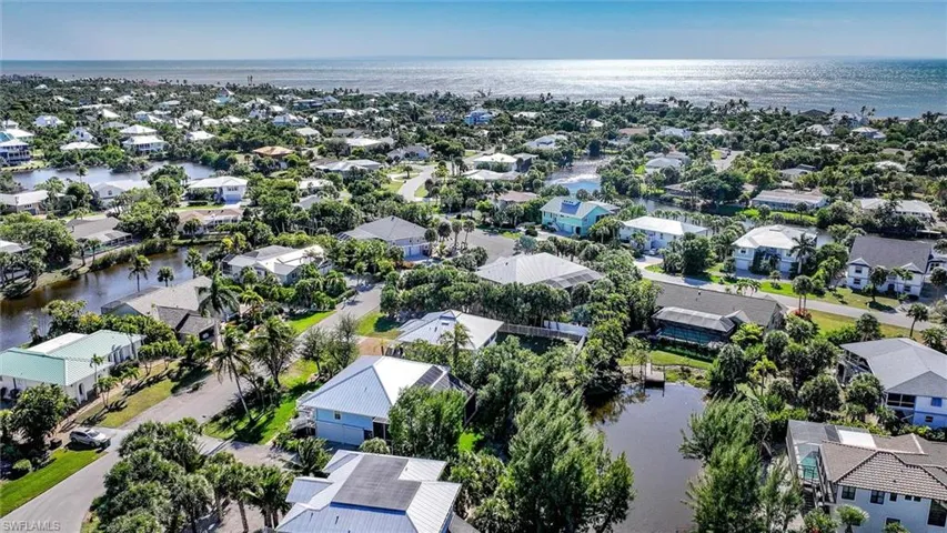 Aerial view of residential area with a large body of water