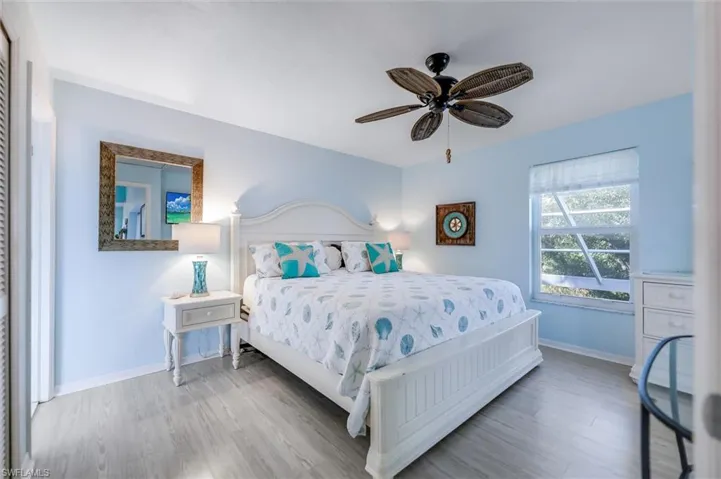 Bedroom featuring wood finished floors and ceiling fan