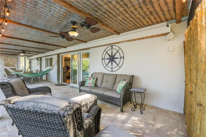View of patio / terrace with an outdoor hangout area, outdoor dining space, and a ceiling fan
