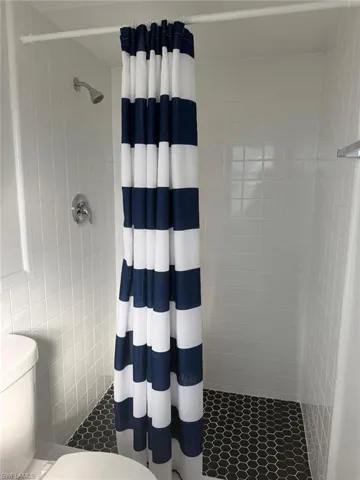 Full bathroom with a stall shower
