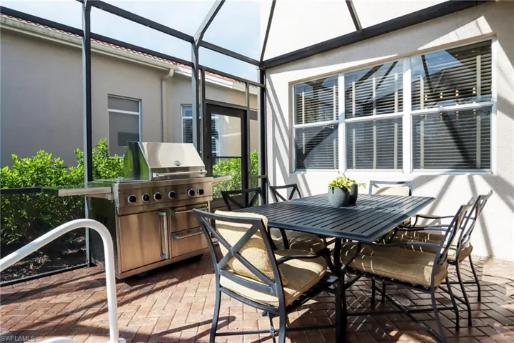 Sunroom featuring outdoor dining area