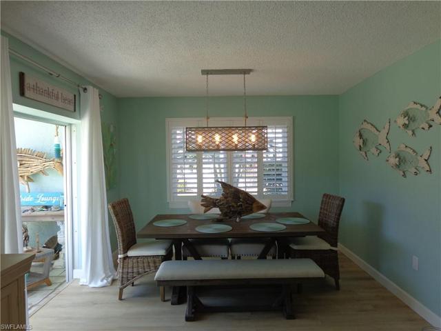 THIS IS A VERY ROOMY DINING AREA JUST OFF THE ALL-SEASON FLORIDA ROOM