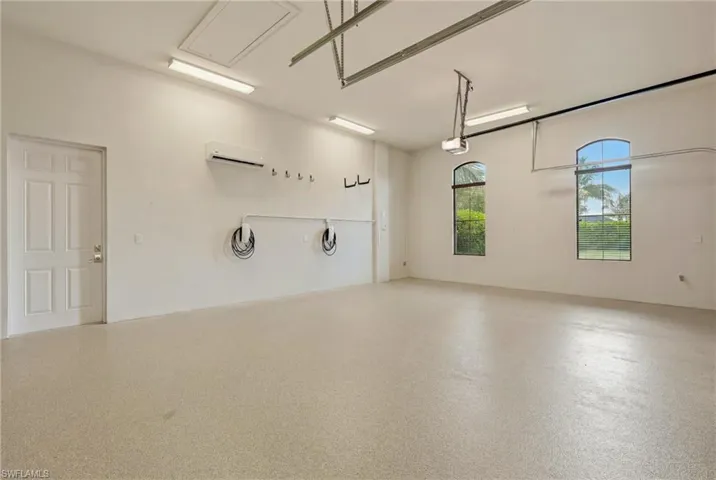 3 car garage with two Tesla chargers