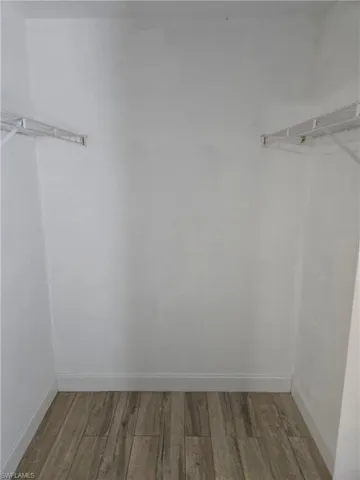Spacious closet with wood finished floors