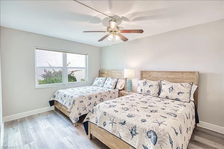Bedroom featuring light wood-style floors and a ceiling fan