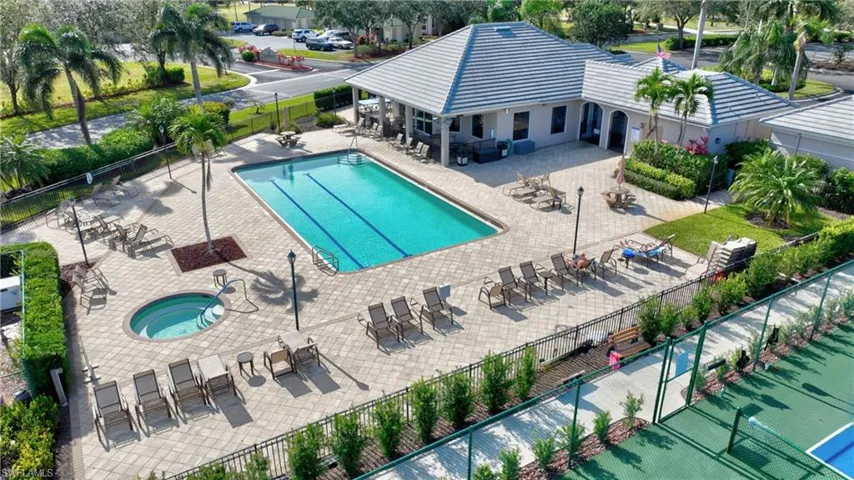 Community pool with a patio