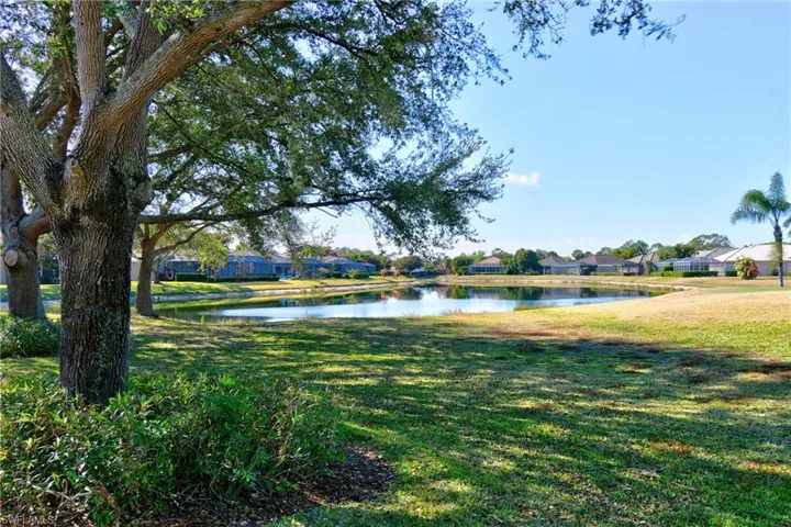 Surrounding community with a water view and a residential view