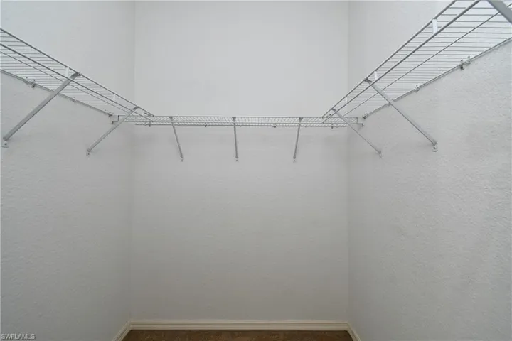 Walk in closet featuring carpet floors