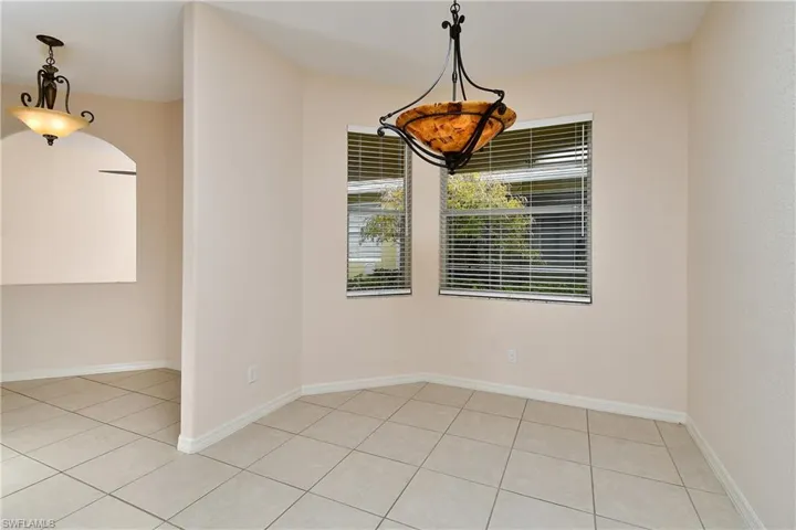 Spare room with light tile patterned flooring