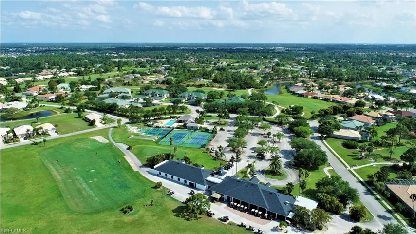 Aerial overview of property's location featuring a large body of water and nearby suburban area