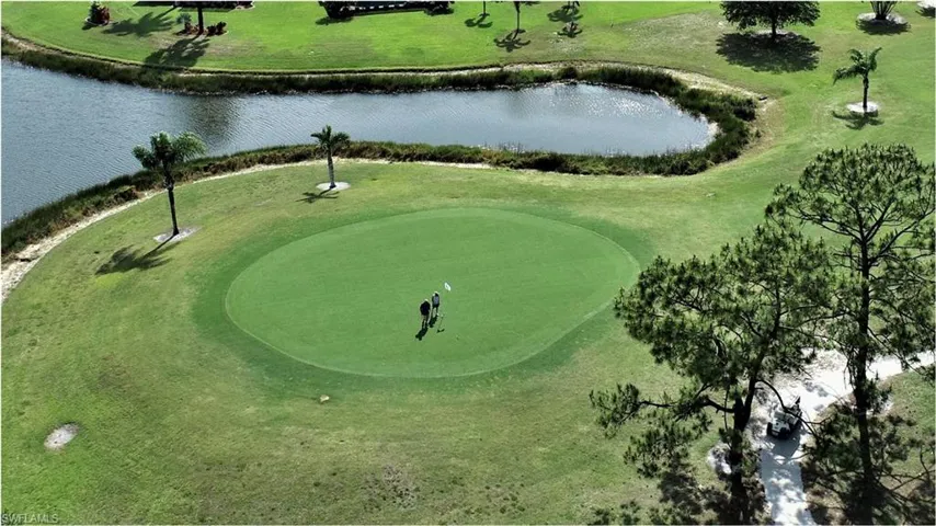 View of home's community with a water view and golf course view