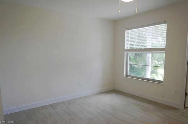 Unfurnished room featuring baseboards