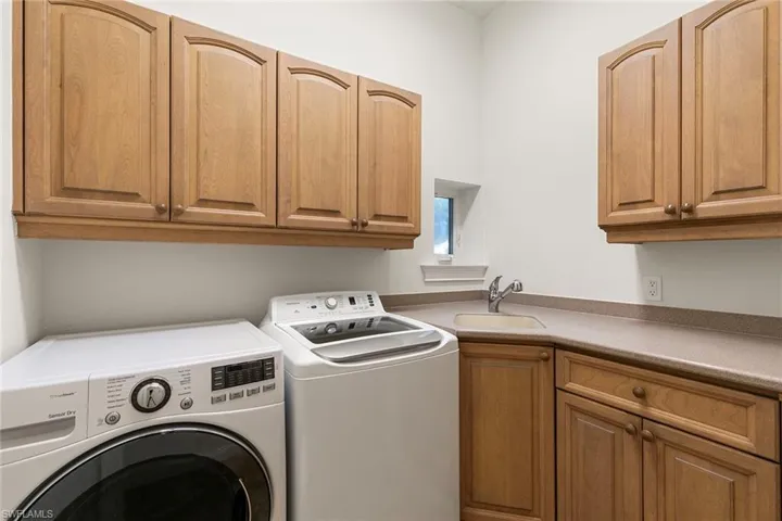 Spacious in-home laundry with an abundance of storage