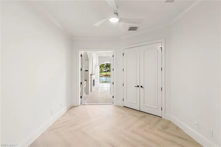 A Spacious ensuite bedroom with Ashford porcelain Honey Blonde Oak tile | Shown will fit a king size bed and end tables