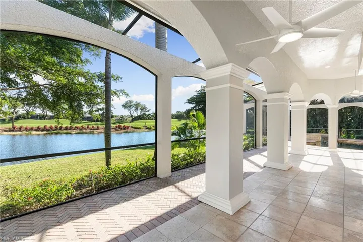 Lanai area compliments the outdoor living space and long water views out to the 9th hole fairway