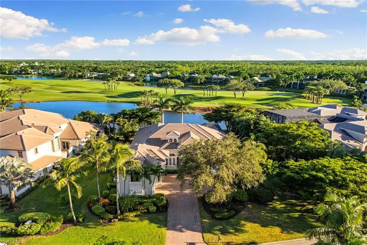 Aerial View of this amazing location with plenty of privacy on each side and a view overlooking the lake and 9th hole