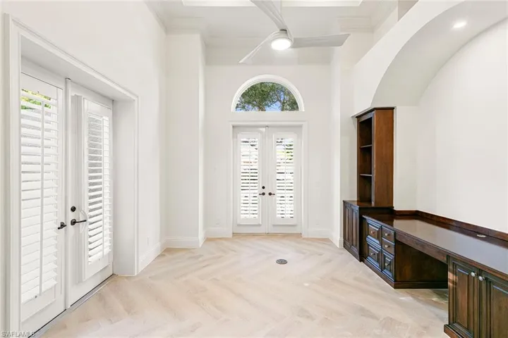 The Home Office features Ashford porcelain Honey Blonde Oak tile with French doors that  open to a Juliet balcony plus a private seating patio area